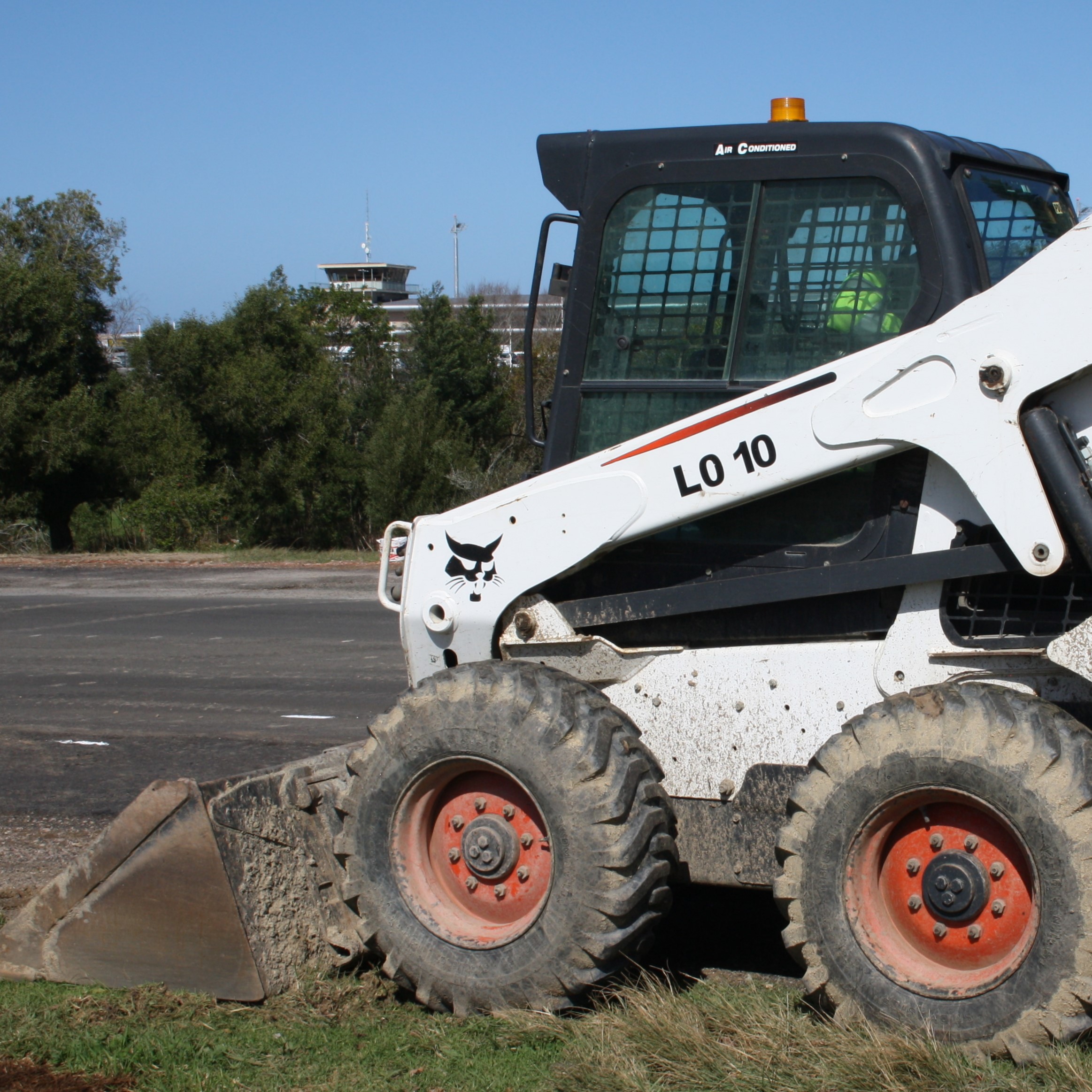 Operate a skid steer loader